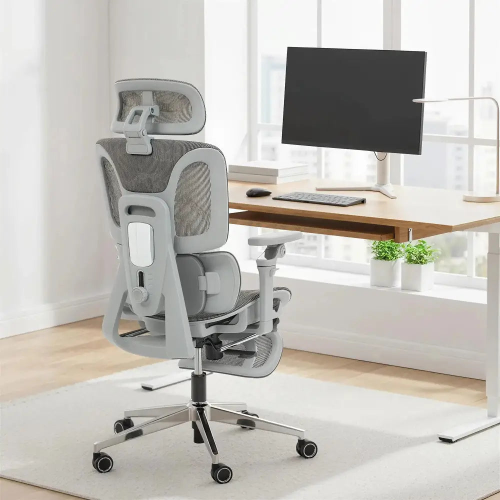 Grey ergonomic office chair with separated backrest, high mesh back, and adjustable headrest.