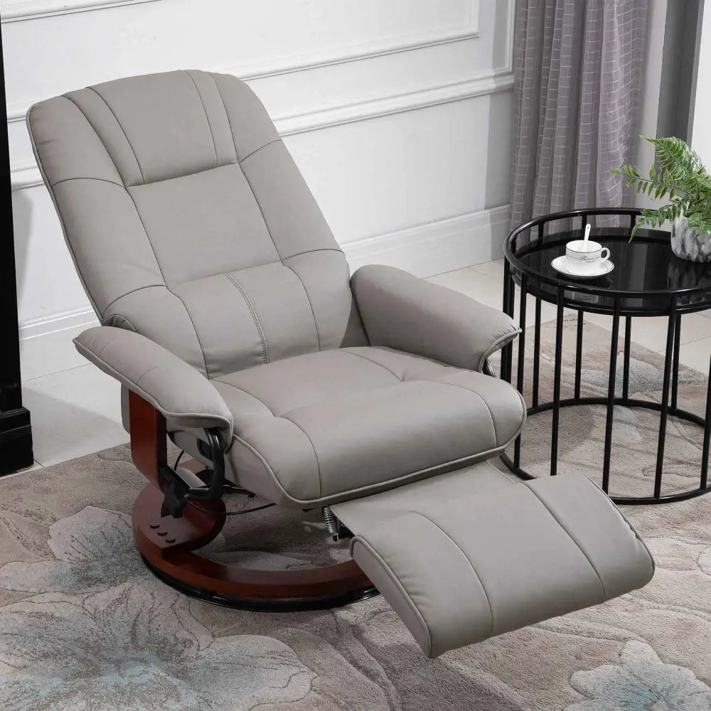 Gray leather recliner chair with a wooden base and footrest.
