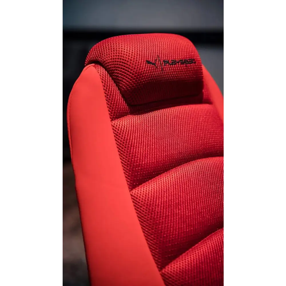 Red perforated mesh car seat with black embroidered logo.